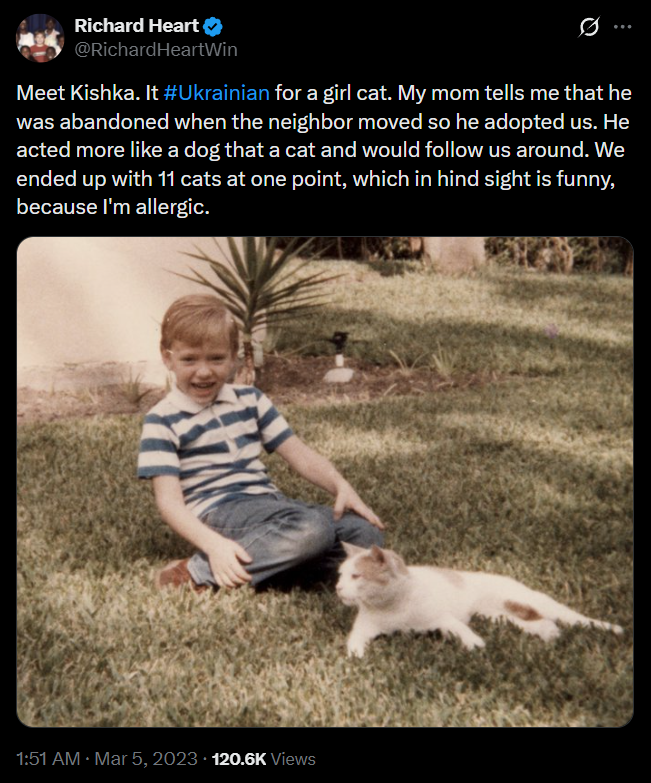 Richard Heart's tweet introducing Kishka, with a childhood photo of him beside the cat on the lawn